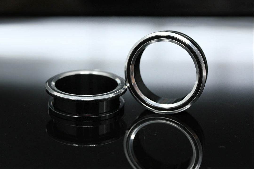 black and silver tunnel gauges