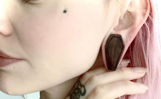 How do I get Coffin Plugs into my Stretched Ears?