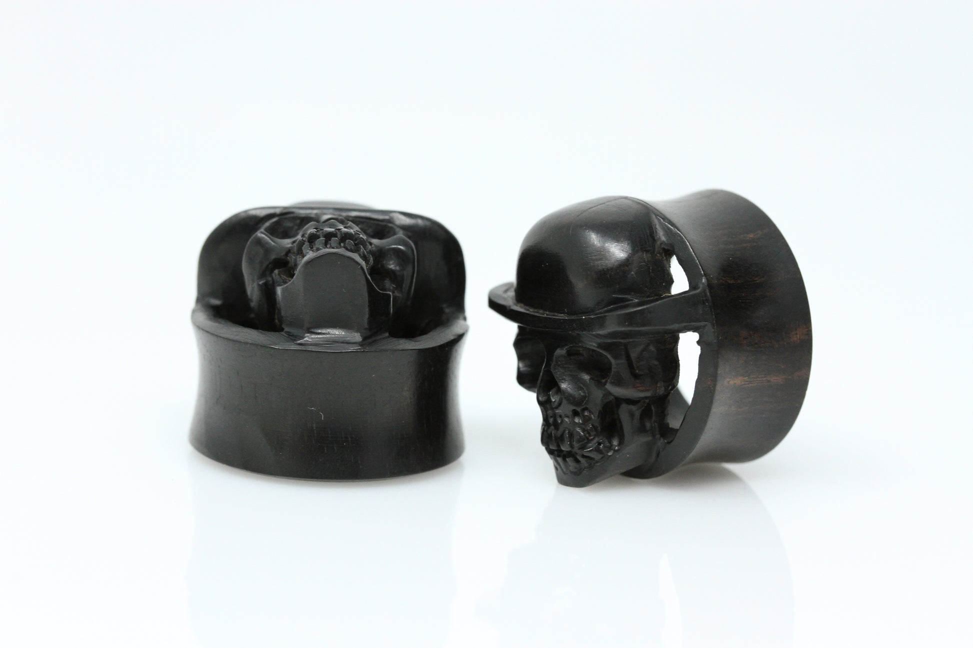 stretched ear skull plugs