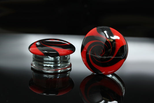 red and black swirl gauge plugs