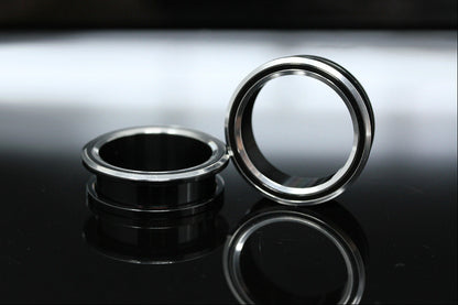 black and silver tunnel gauges