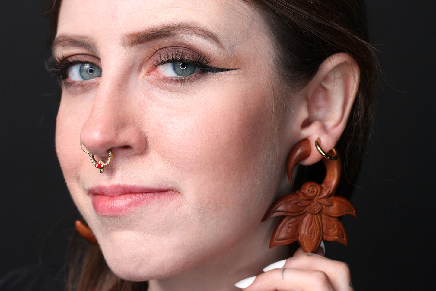 wooden gauges hangers stretched ears