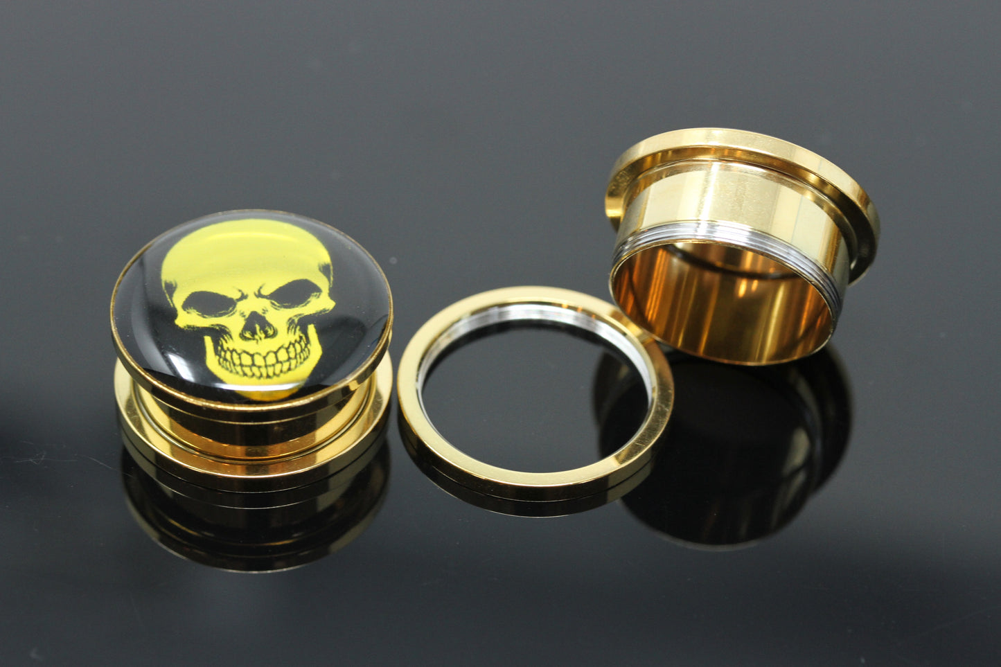 Holographic gold screw on plugs