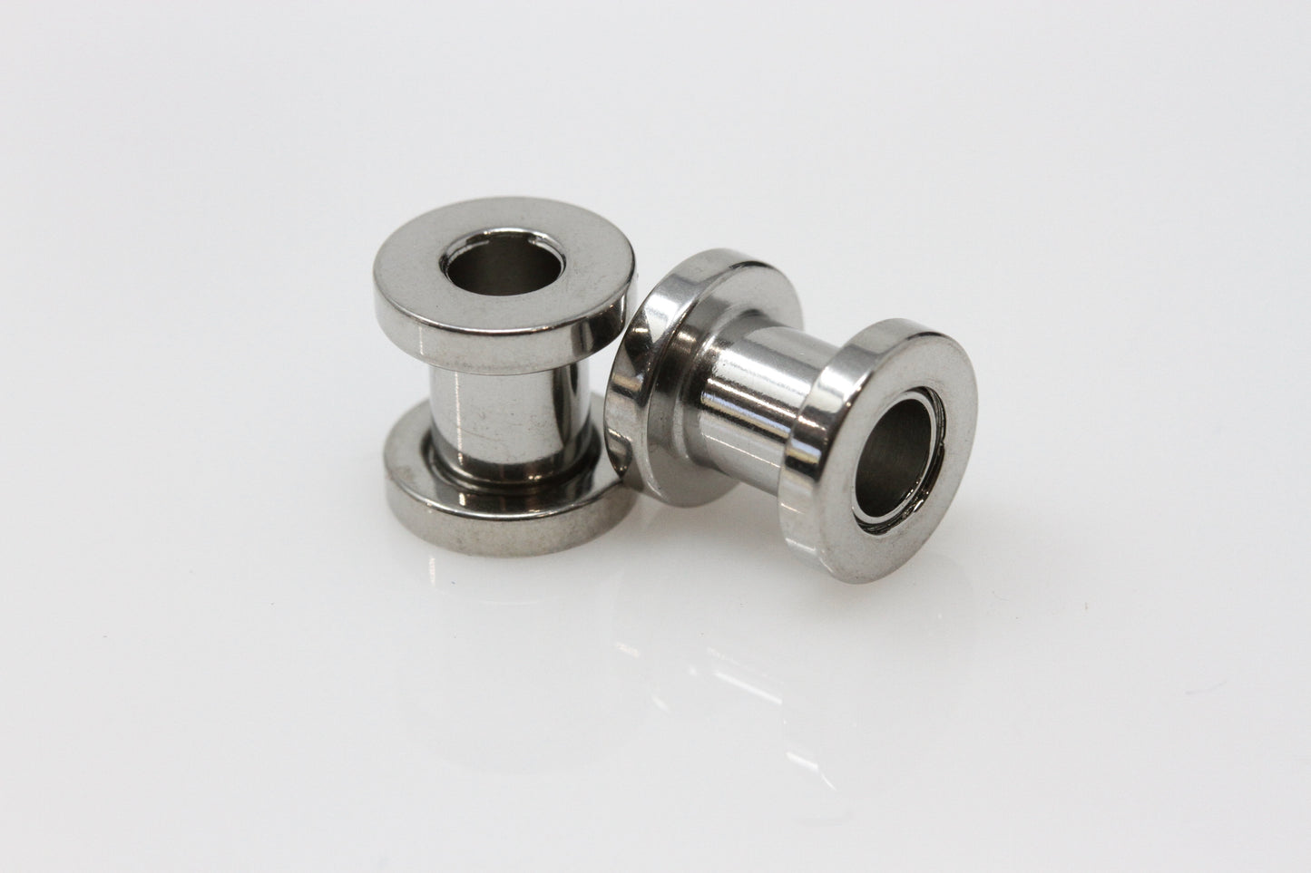 Screw back stainless steel tunnel plugs