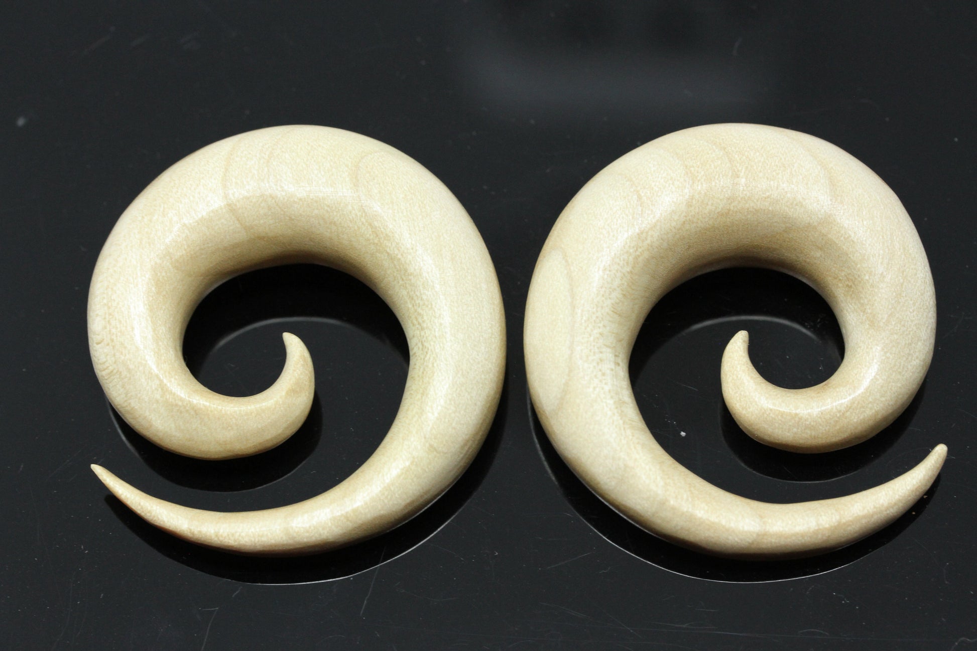 hand carved spirals ear stretch