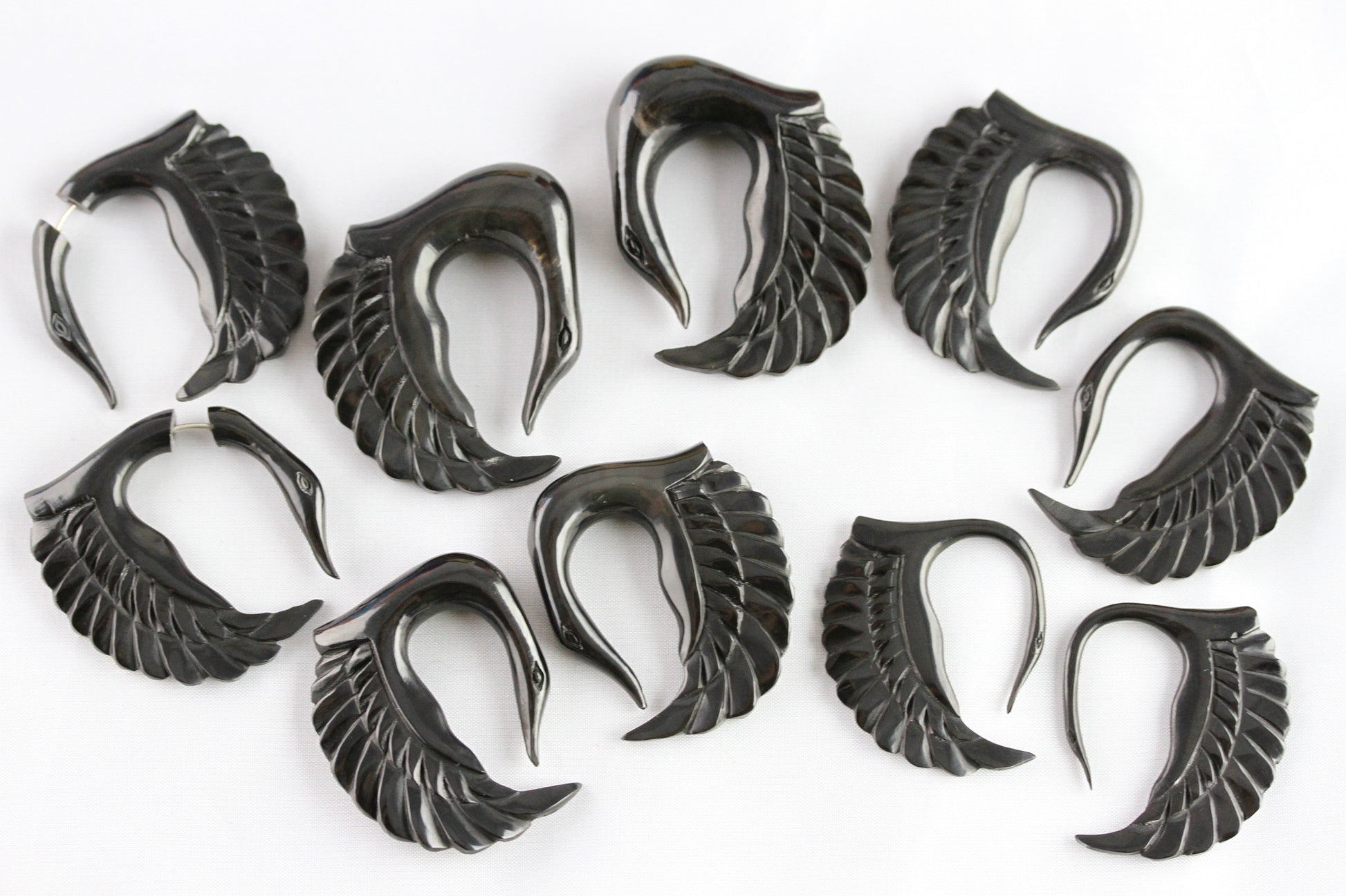 black carved swan plugs