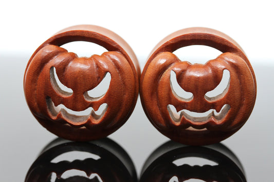 Carved wood pumpkin stretched ears