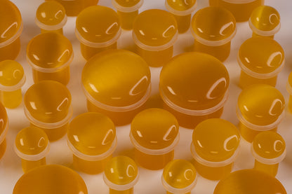 yellow glass plugs